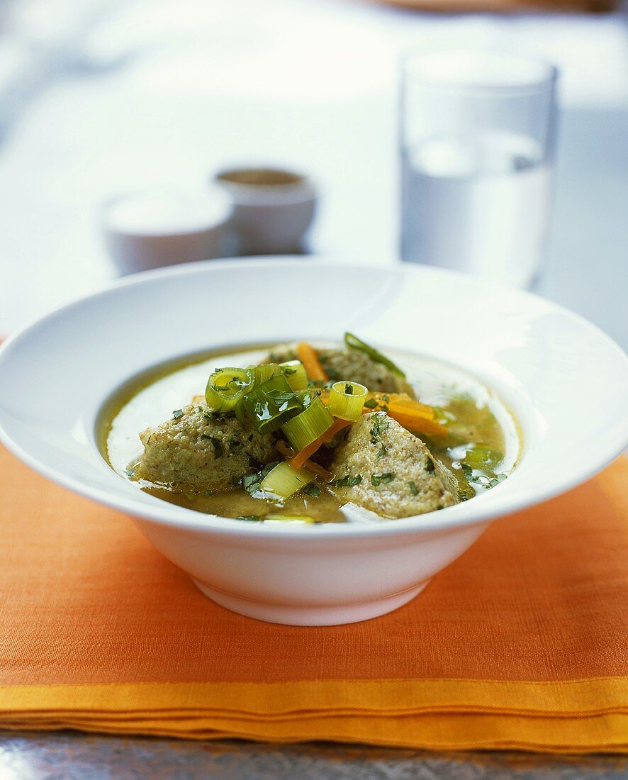 Vegetable soup with pesto dumplings