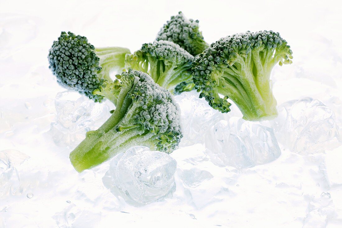 Frozen broccoli florets on ice