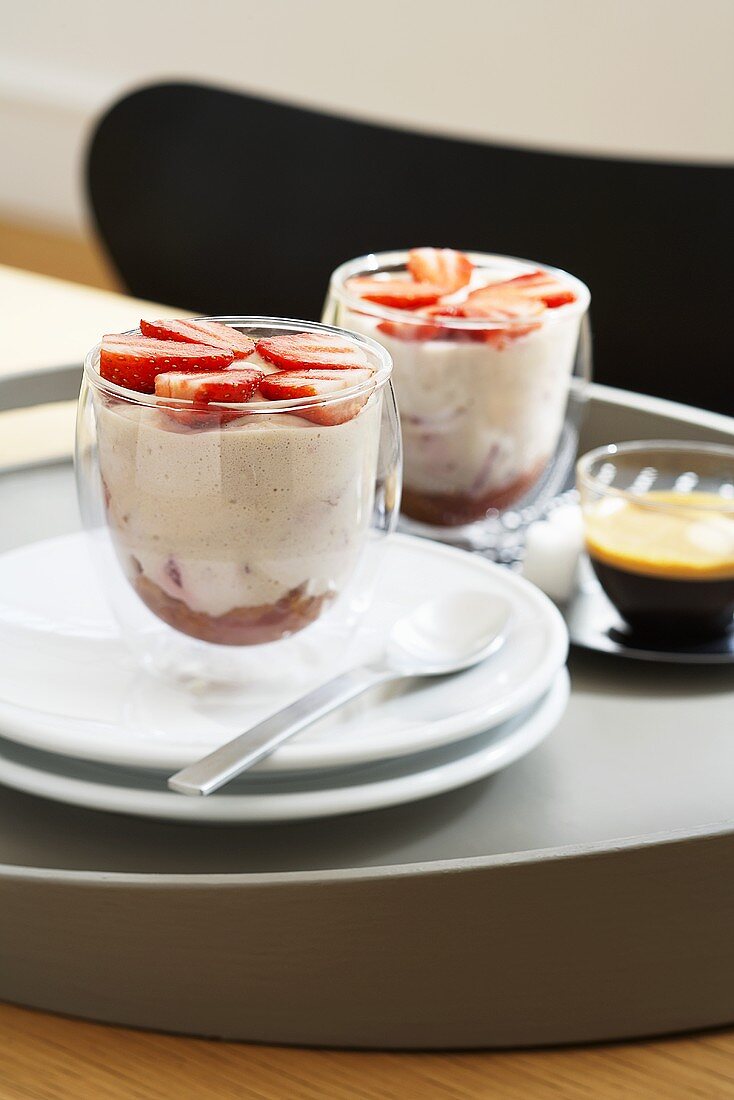 Strawberry tiramisu in glasses with espresso on a tray