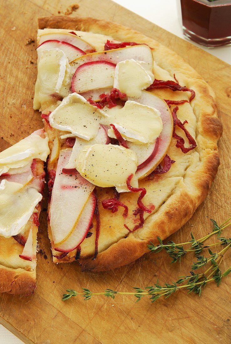 Flatbread topped with apple, pear, onion and cheese