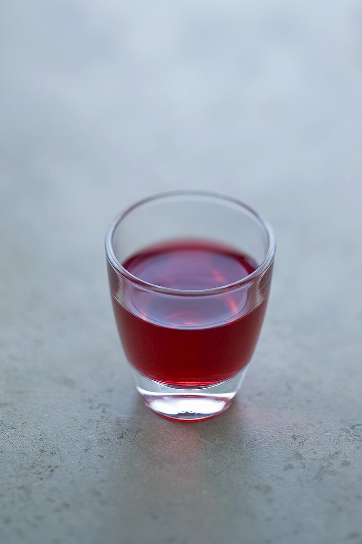 A glass of cassis liqueur