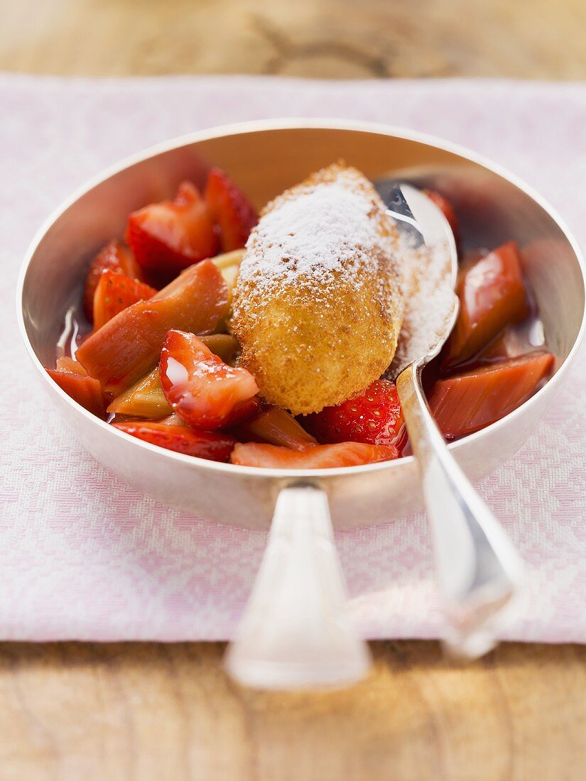 Semolina dumpling on stewed rhubarb and strawberries