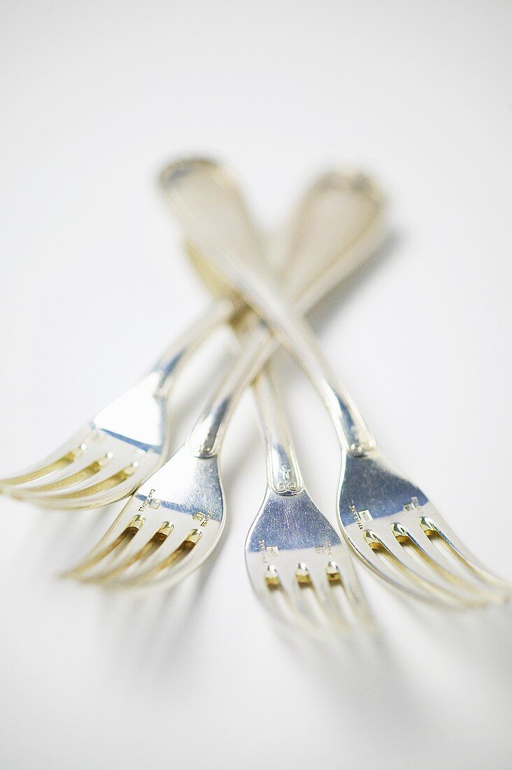 Four silver forks