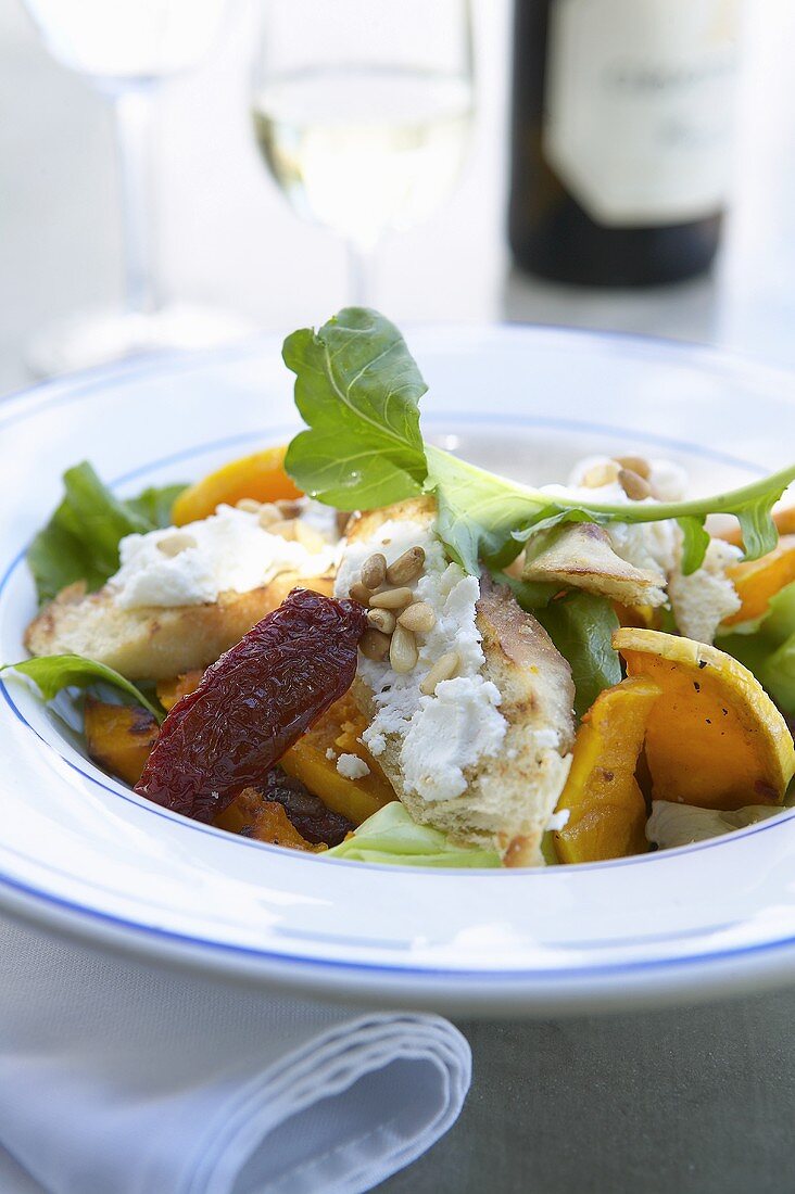 Salad with butternut squash and soft cheese