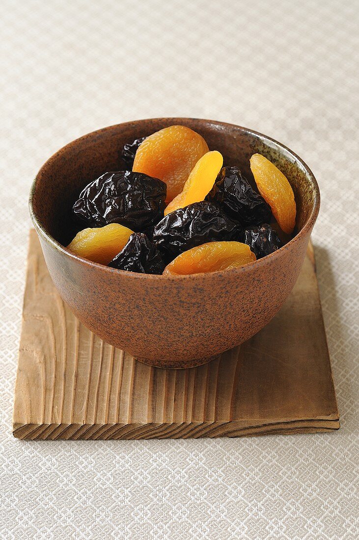 Prunes and dried apricots in bowl