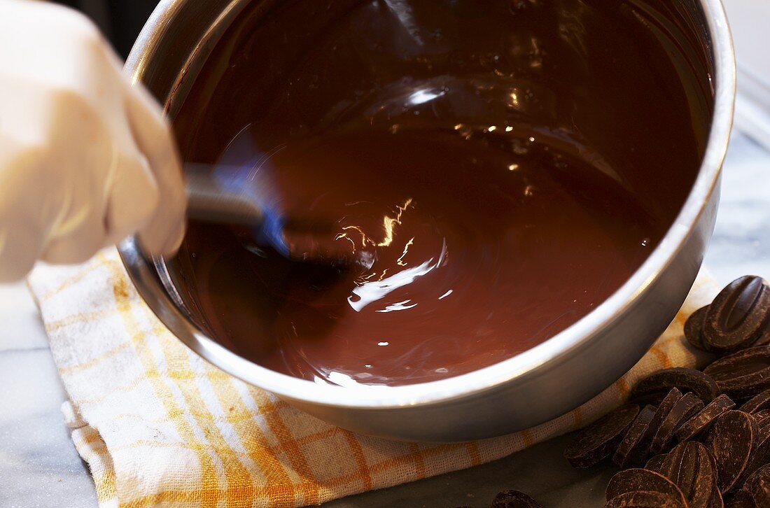 Melting chocolate couverture for making chocolates