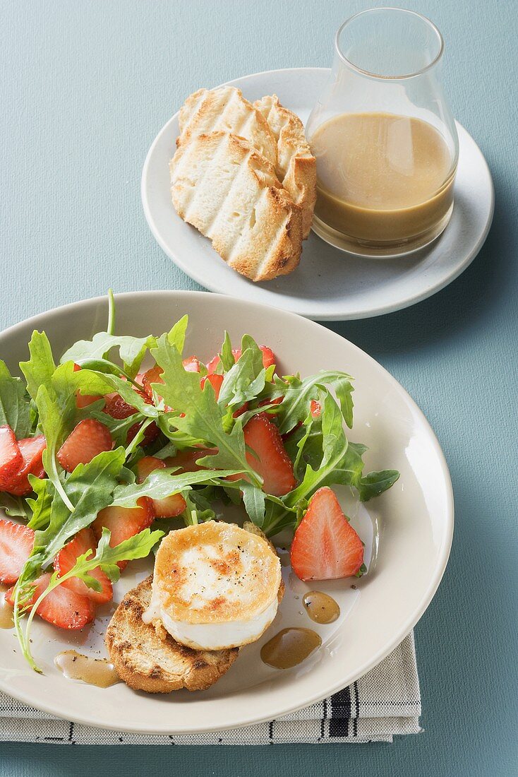 Rocket and strawberry salad with baked cheese and mustard dressing