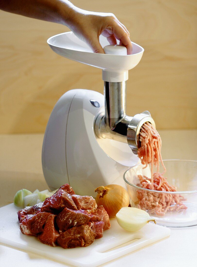 Mincing meat in a mincer