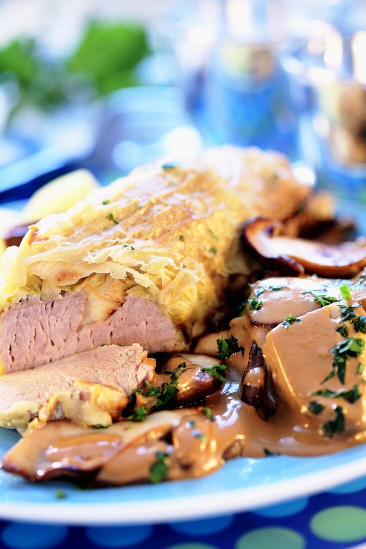 Pork loin in pastry with mushroom sauce