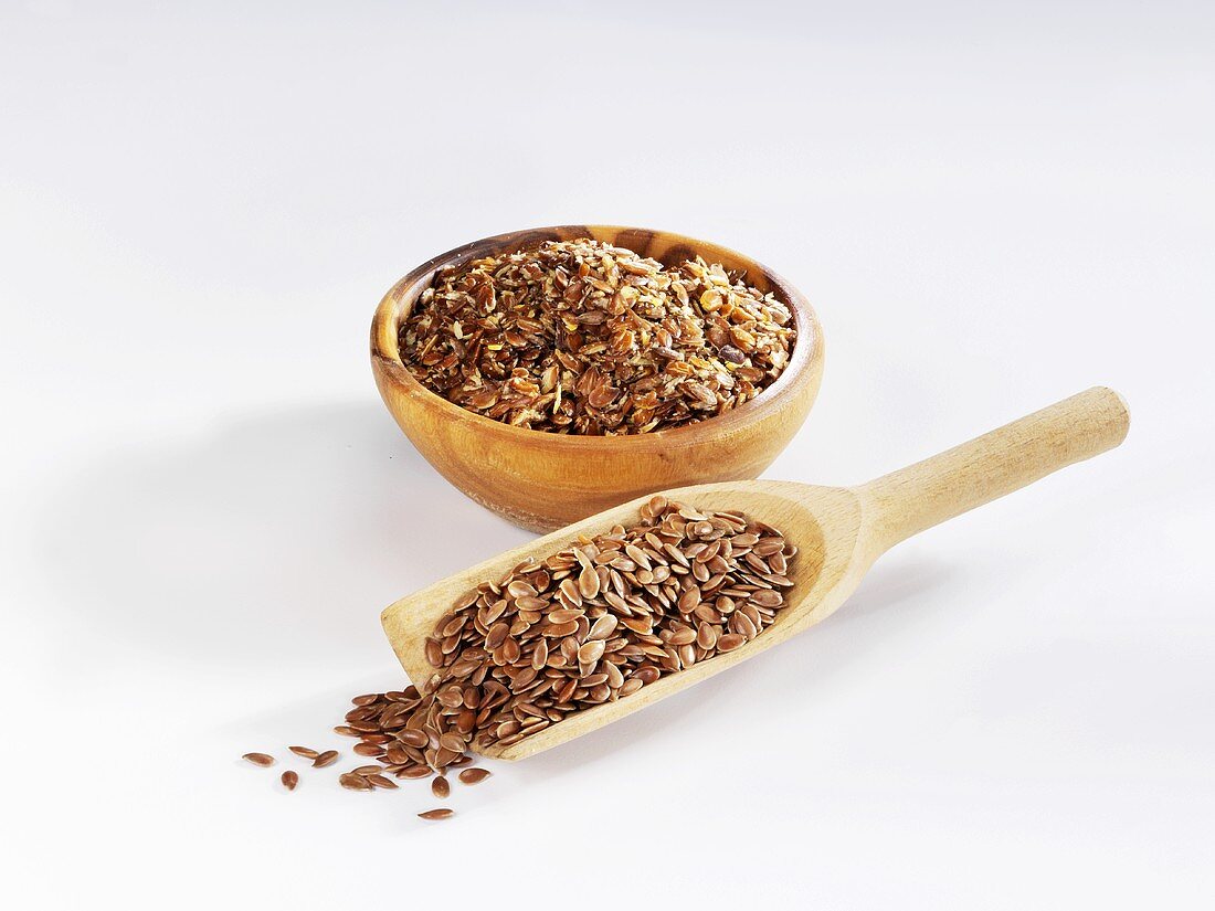 Linseed in a wooden scoop and a small bowl