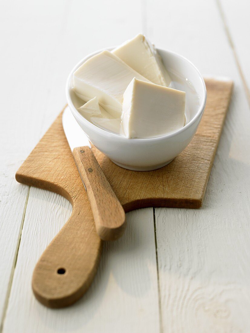 Silken tofu in a small white bowl