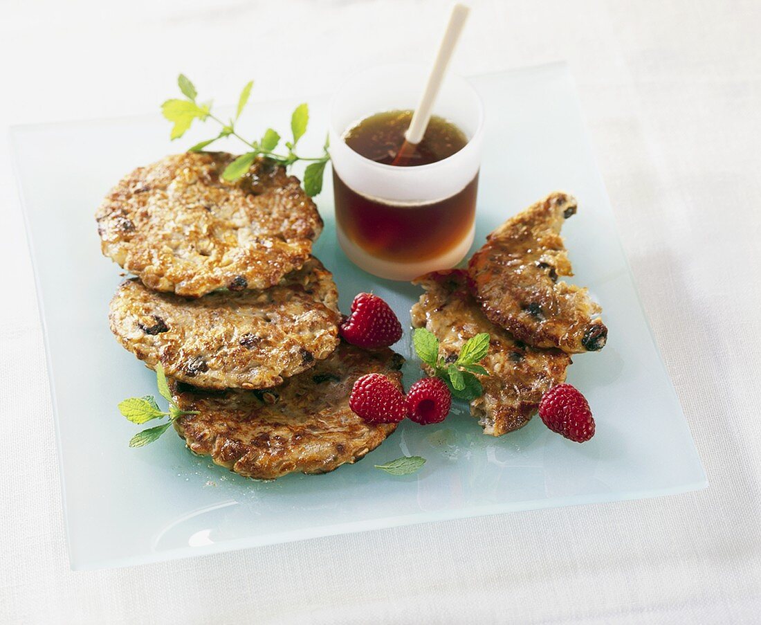 Fruit muesli and soya milk pancakes and syrup