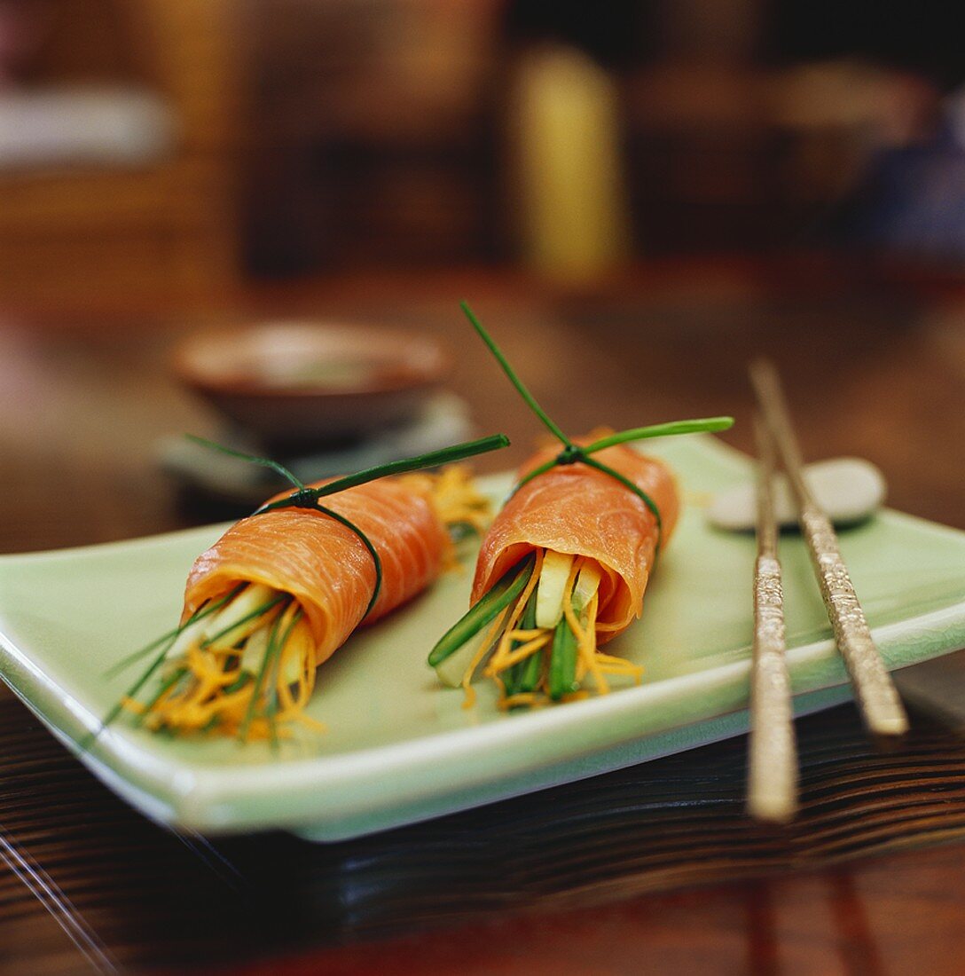 Smoked salmon rolls filled with vegetable sticks