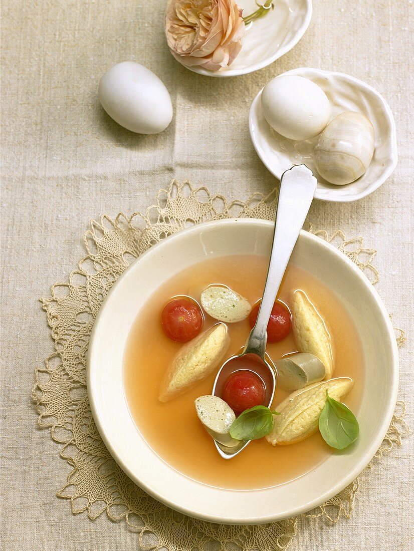 Clear tomato soup with cheese dumplings