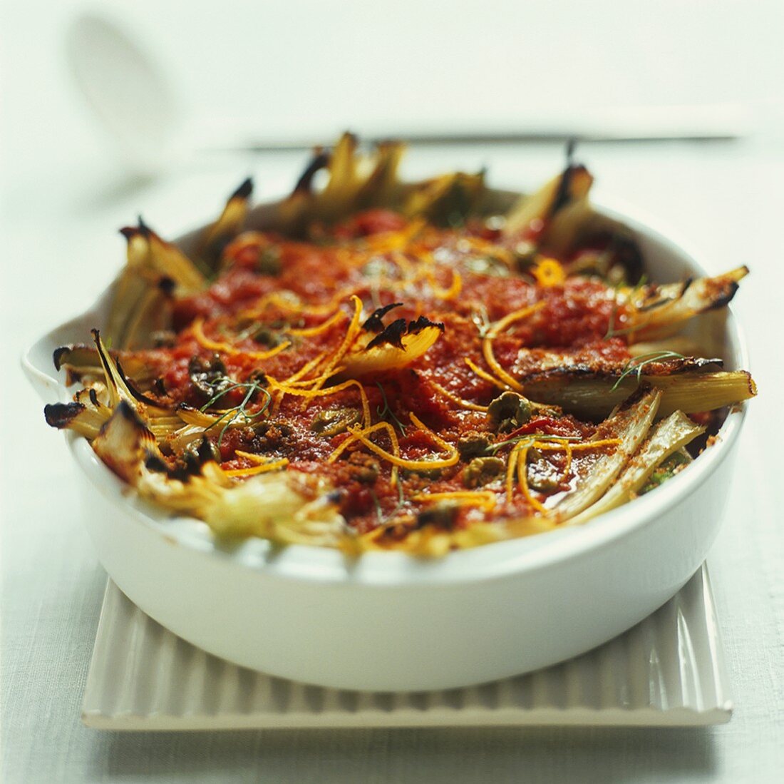 Fennel and tomato gratin with olives and orange zest