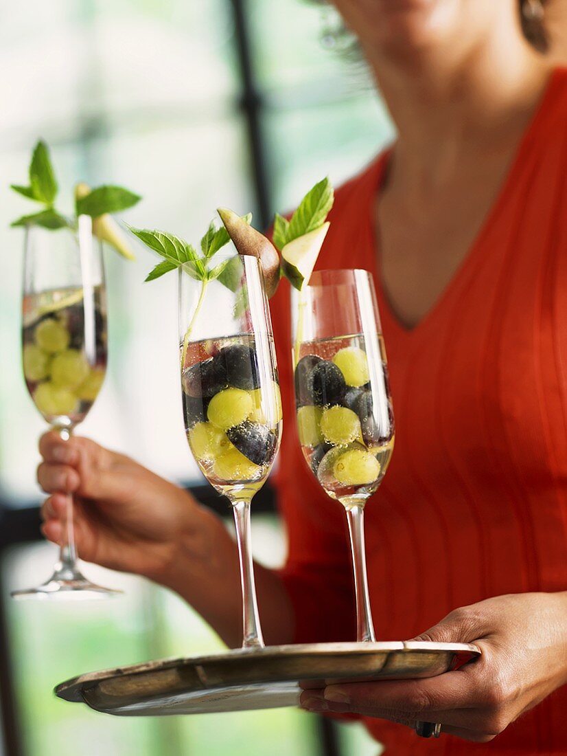 Sparkling wine cocktail with grapes