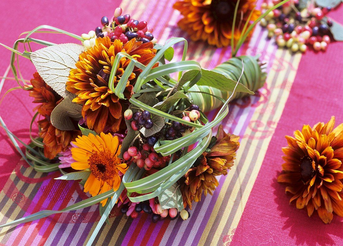 Bouquet of rudbeckia, calendula, viburnum berries & grasses