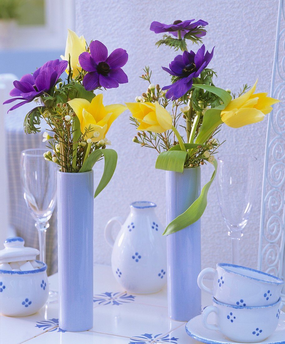 Posies of anemones, tulips and wax flowers