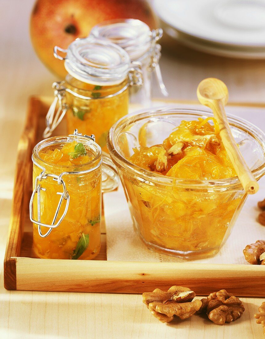 Mango jam with ginger, orange jam with walnuts