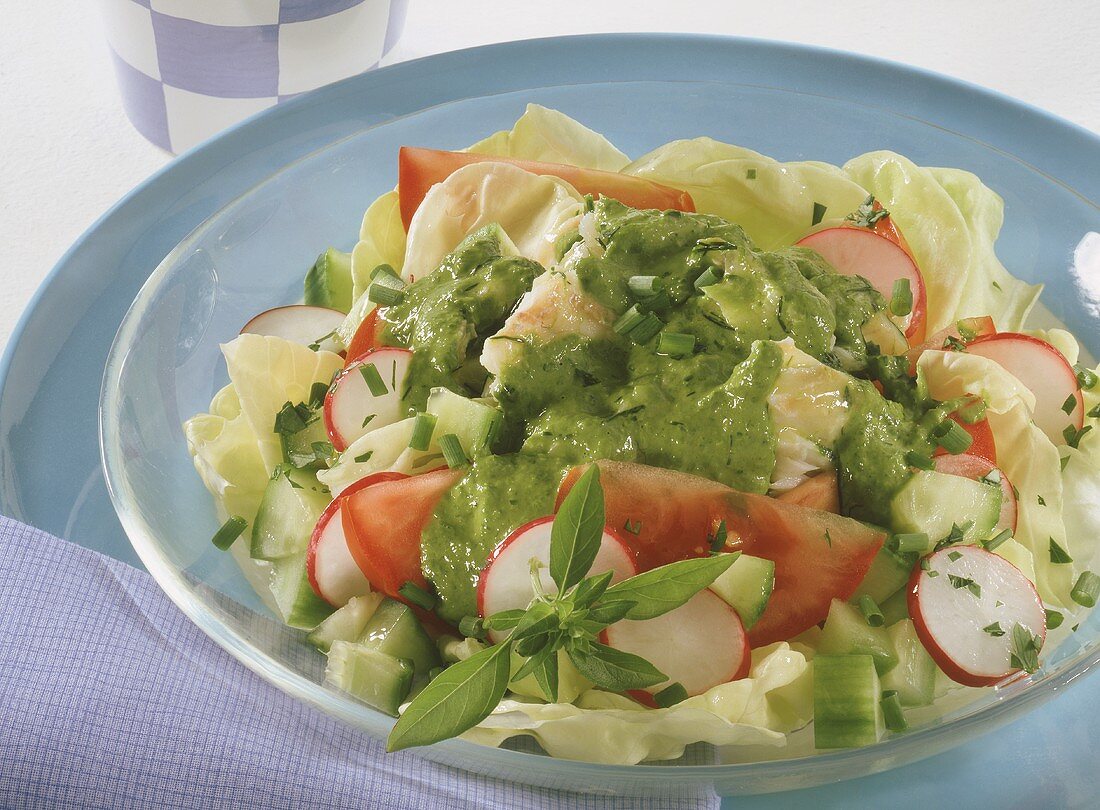 Mixed salad with fish fillet and herb dressing