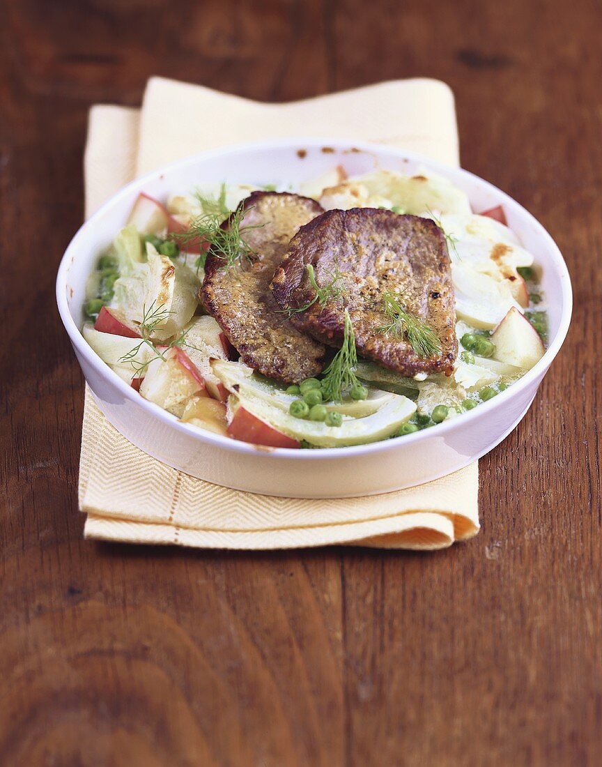 Pea and fennel bake with beef medallions