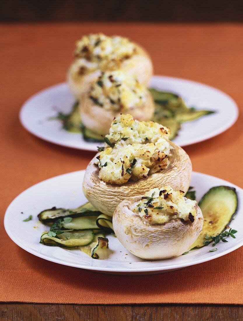 Stuffed mushrooms on courgettes