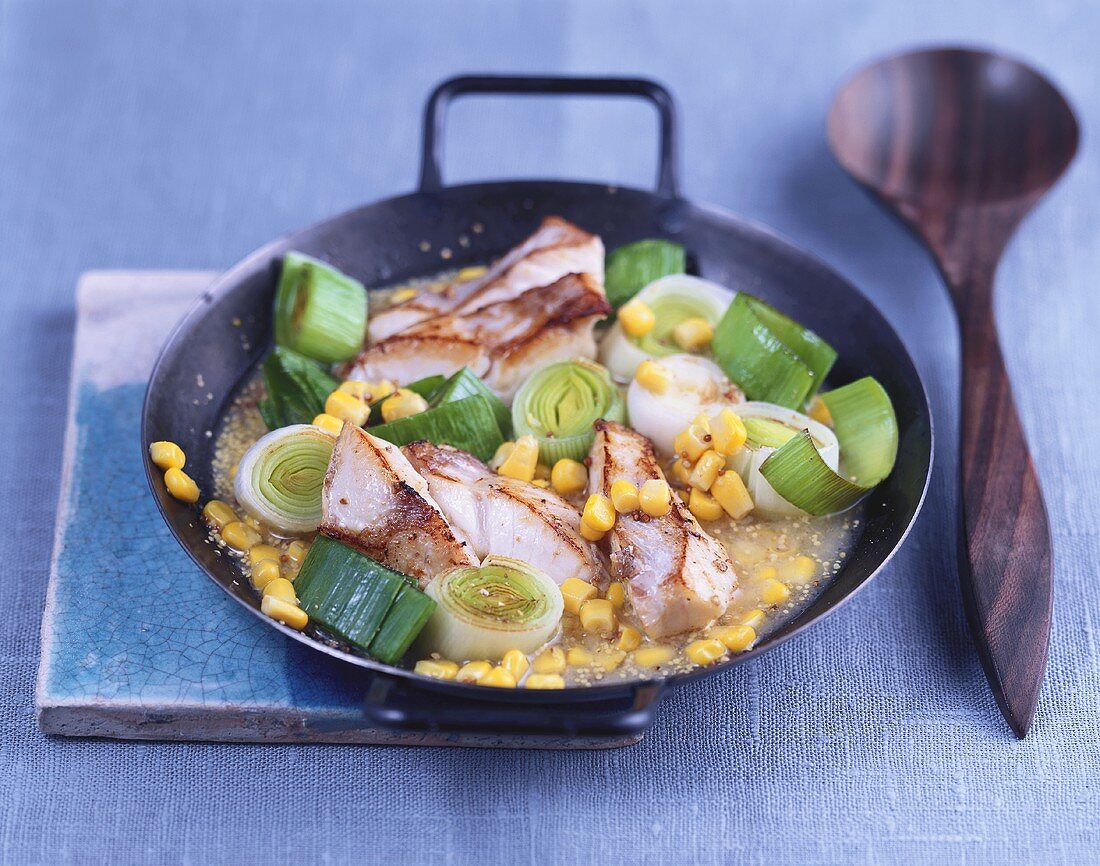 Strips of coley with stir-fried leeks