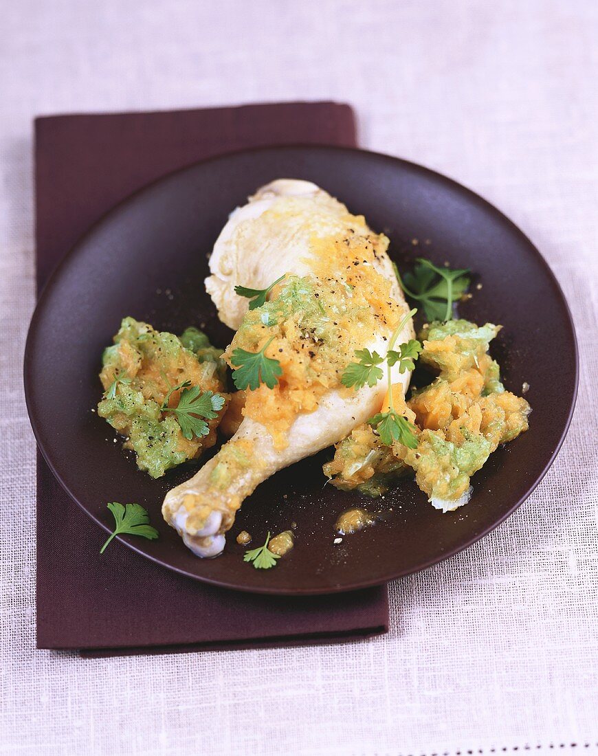 Cooked chicken leg with vegetable puree