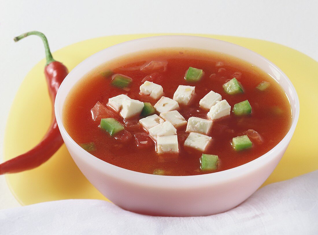 Tomato and pepper soup with sheep's cheese