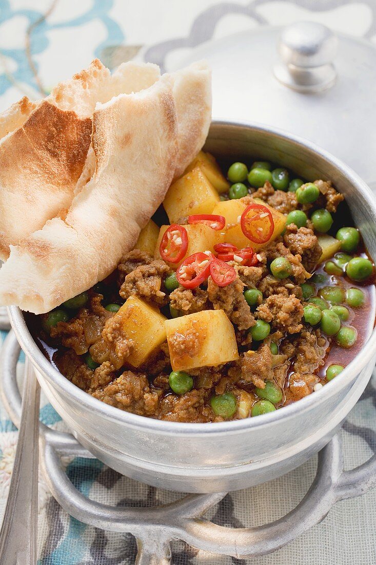Mince and pea stew with flatbread