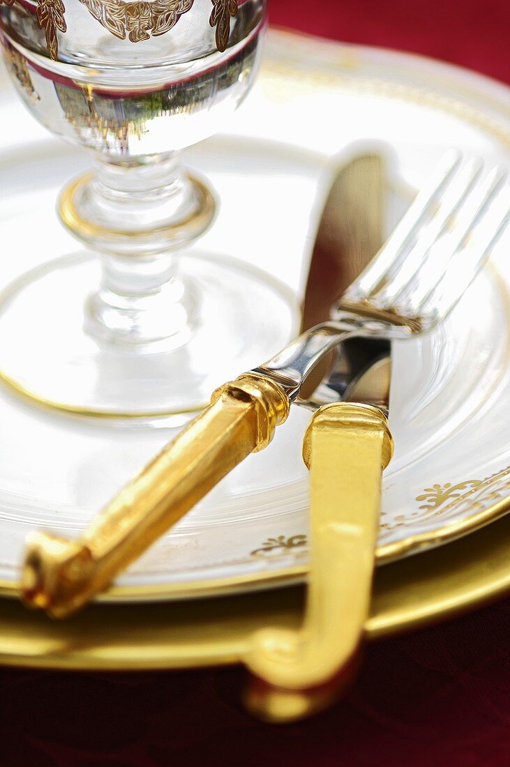 Festive place-setting with gold cutlery