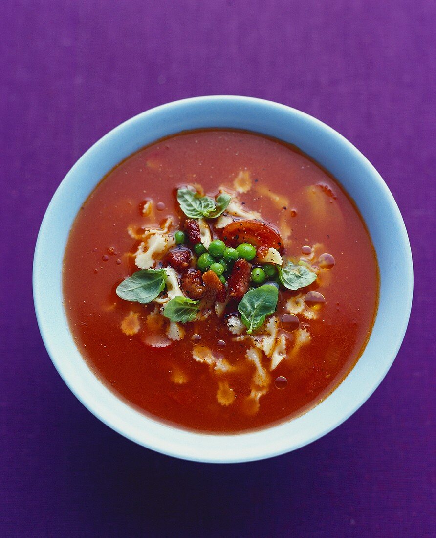 Tomato soup with noodles and basil