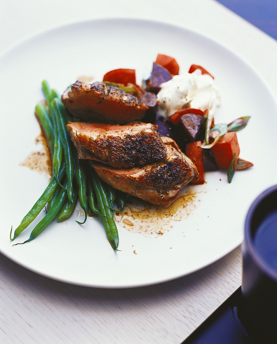 Loin of pork with caraway, green beans and beetroot