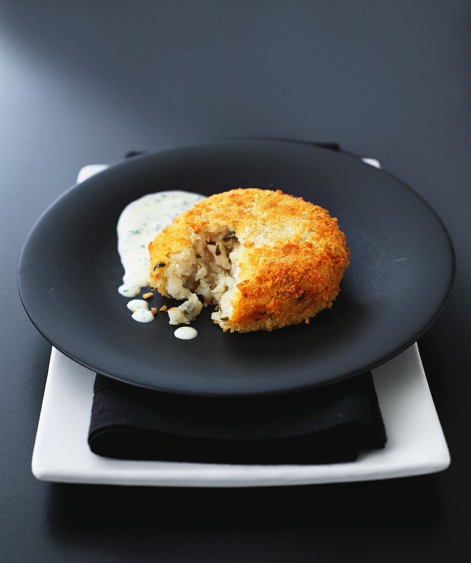 Fish cake with parsley sauce