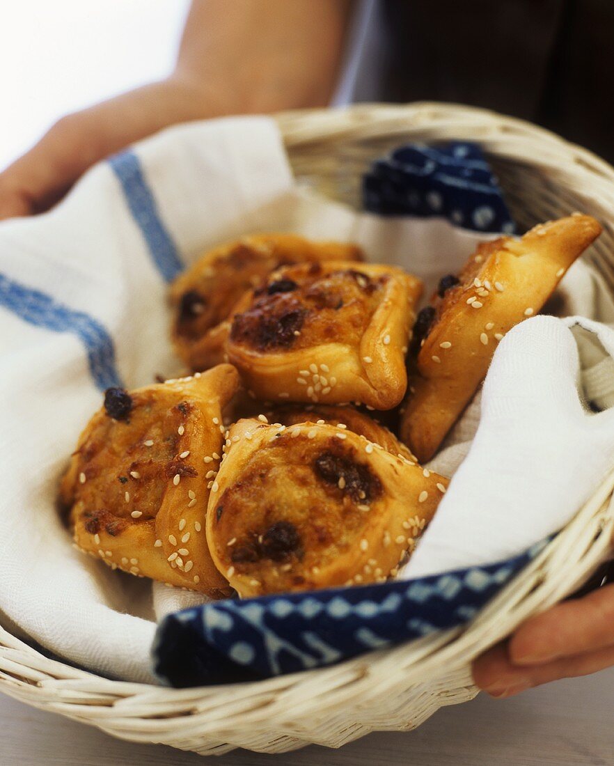 Cheese pastries with sesame seeds in basket