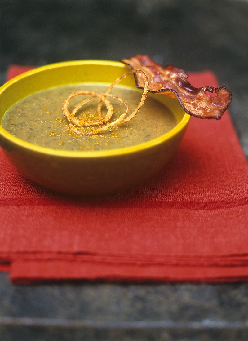 Lentil soup with bacon, fried onions and walnut oil