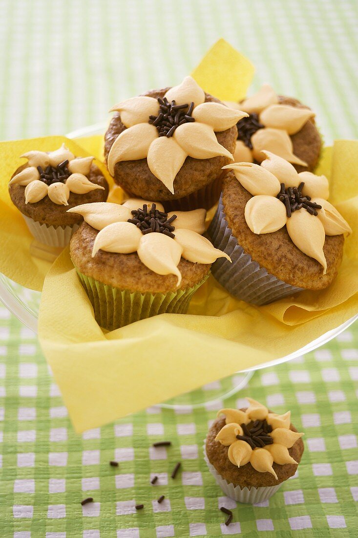 Orange nut muffins with orange cream & chocolate sprinkles