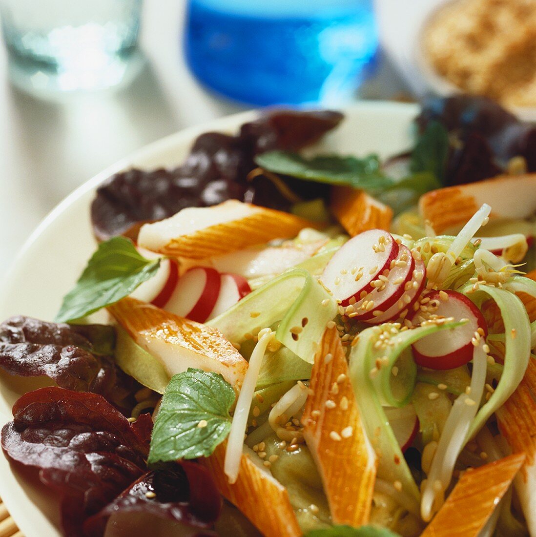 Mixed salad with surimi and sesame seeds