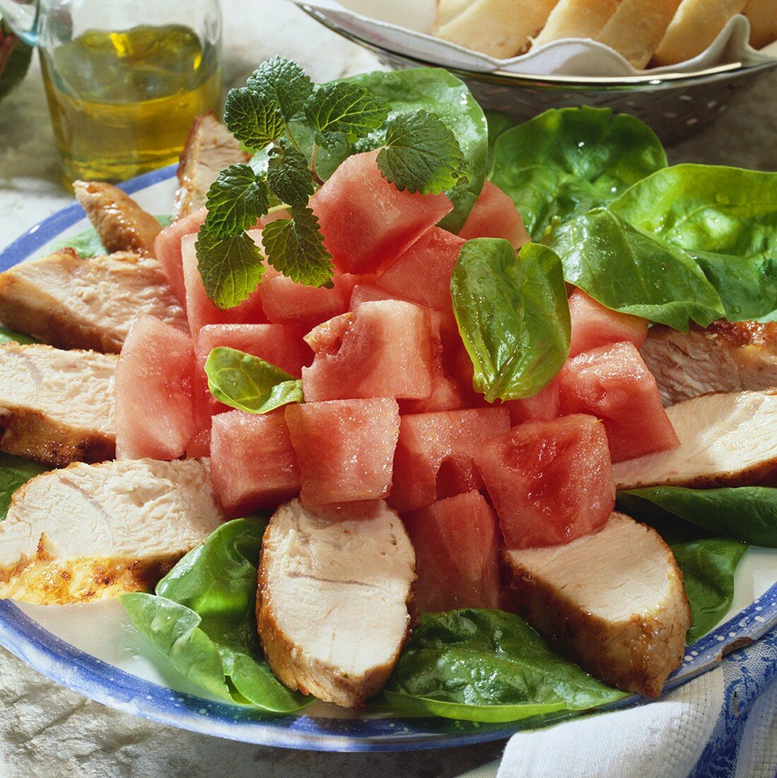 Chicken breast with spinach salad and melon