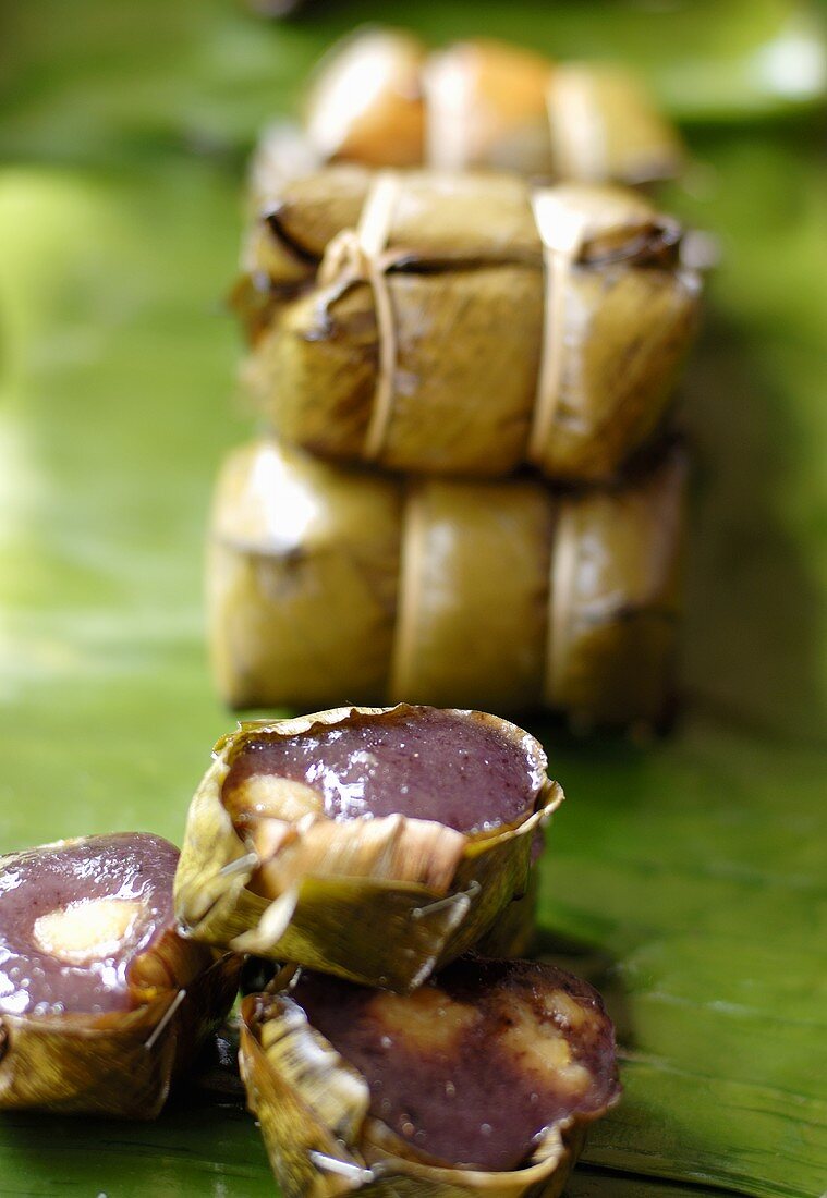 Sticky rice with spice paste steamed in banana leaves (Thailand)