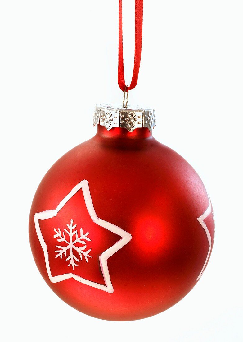 A red Christmas bauble with a white star