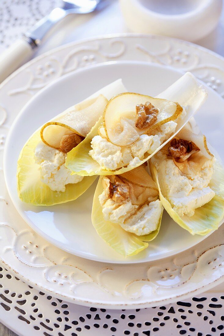 Chicory appetisers with soft cheese, pear and walnut