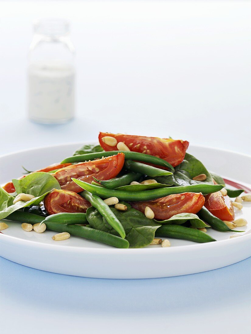 Bean and tomato salad with pine nuts
