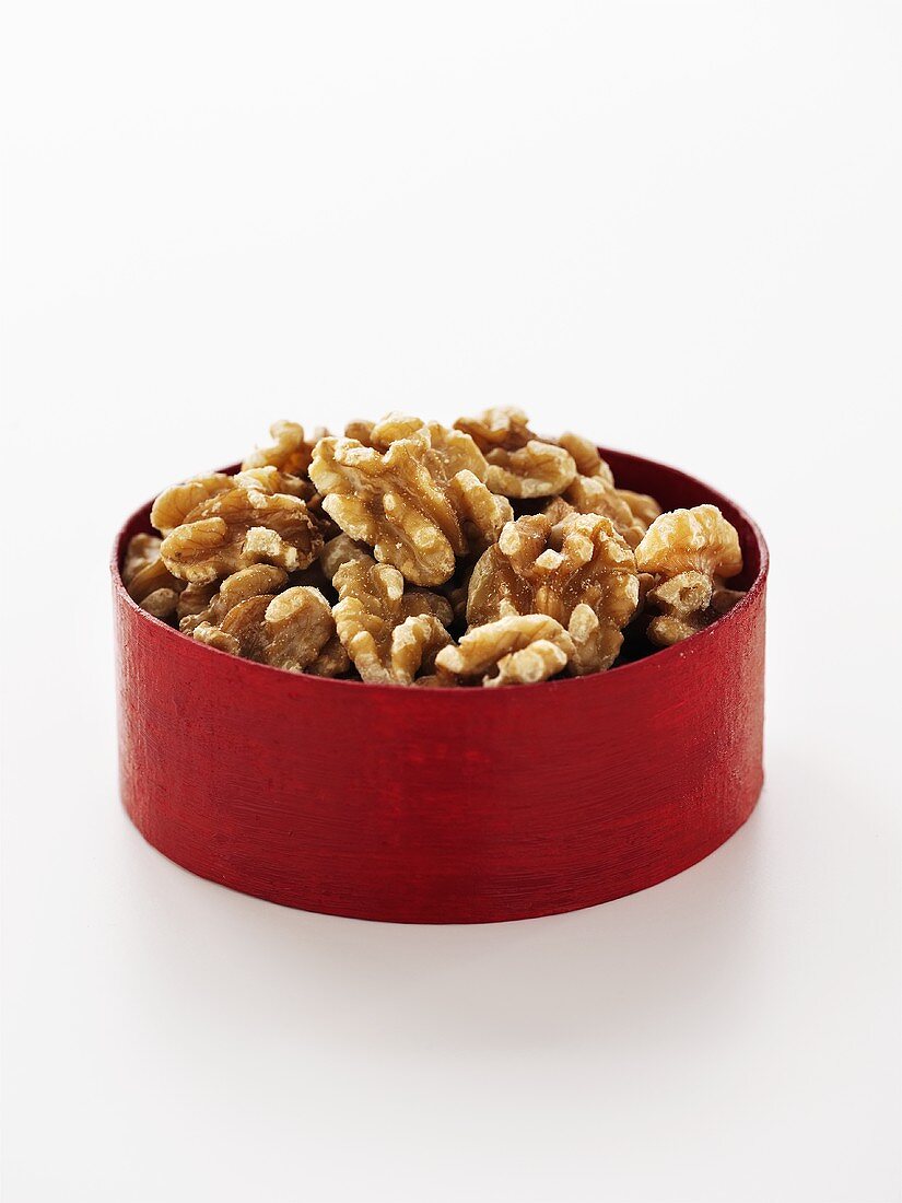Shelled walnuts in red box