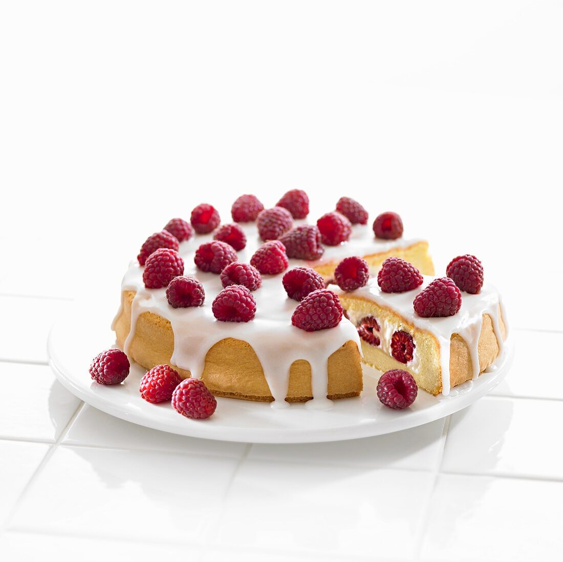 Raspberry sponge cake with whipped cream and icing