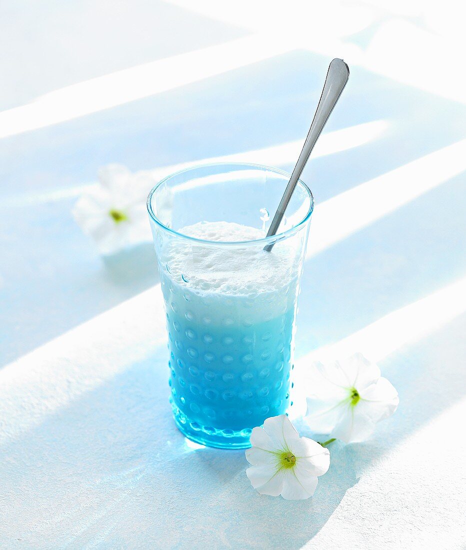 Cocktail made with Blue Curaçao and milk
