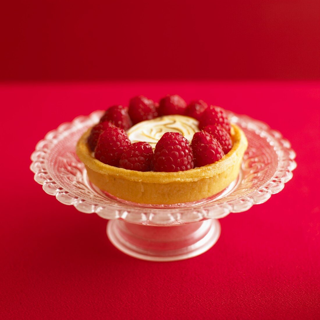 Lemon meringue tart with raspberries