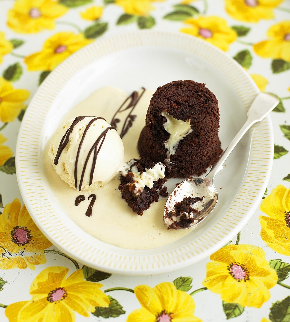 Molten chocolate pudding with white chocolate inside, vanilla ice cream