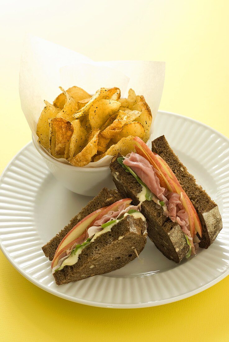 Wholemeal ham and apple sandwich with potato crisps