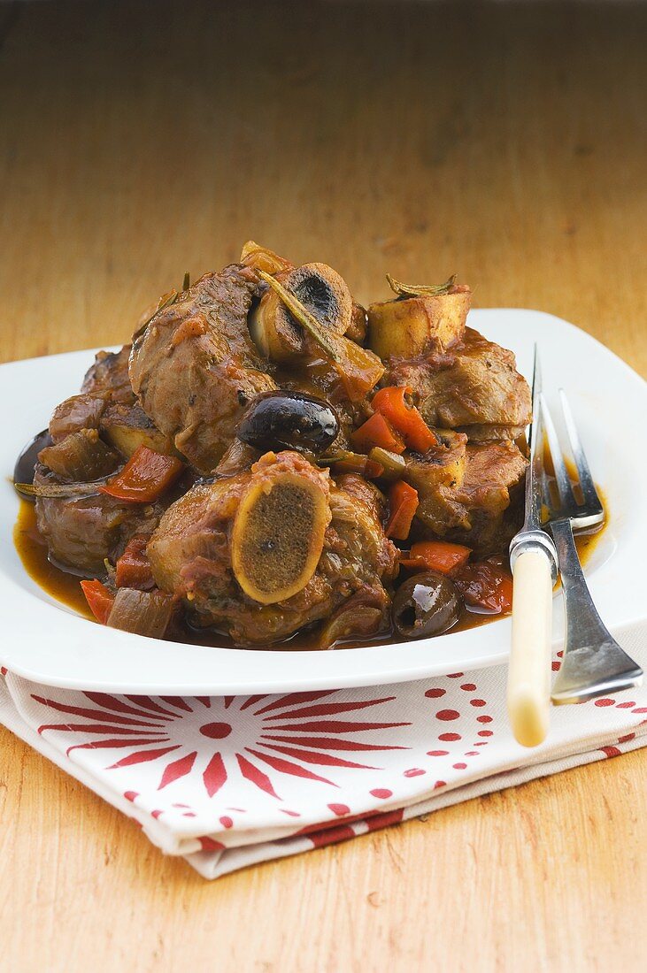 Ossobuco con le olive (Slices of veal shank with olives, Italy)